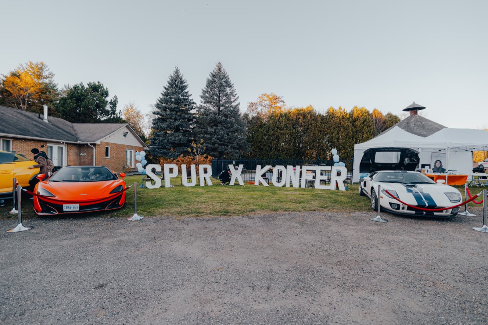 A SPUR x Konfer sign on the lawn at the BBQ festival