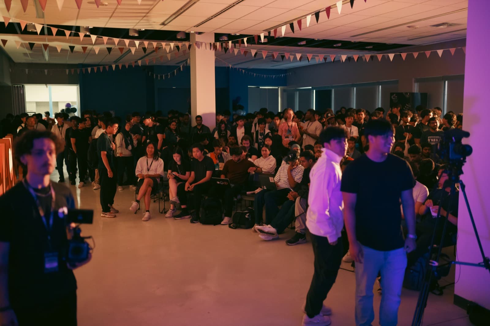 Camera and stage crew filming at SpurHacks 2025